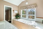 Master Suite Bath features granite his and hers vanity and separate water closet with shower